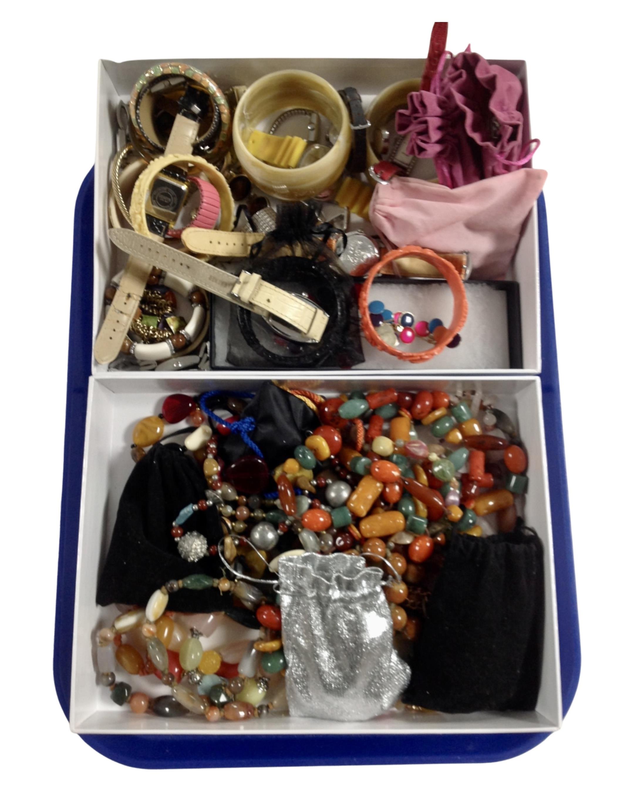 Two boxes containing a quantity of assorted costume jewellery.