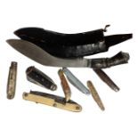 A tray containing Kukri knife in sheath together with seven further folding pocket knives.