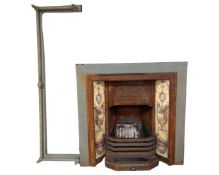 A Victorian cast iron tiled fireplace, with fire curb.