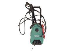 A Qualcast pressure washer with hose and accessories