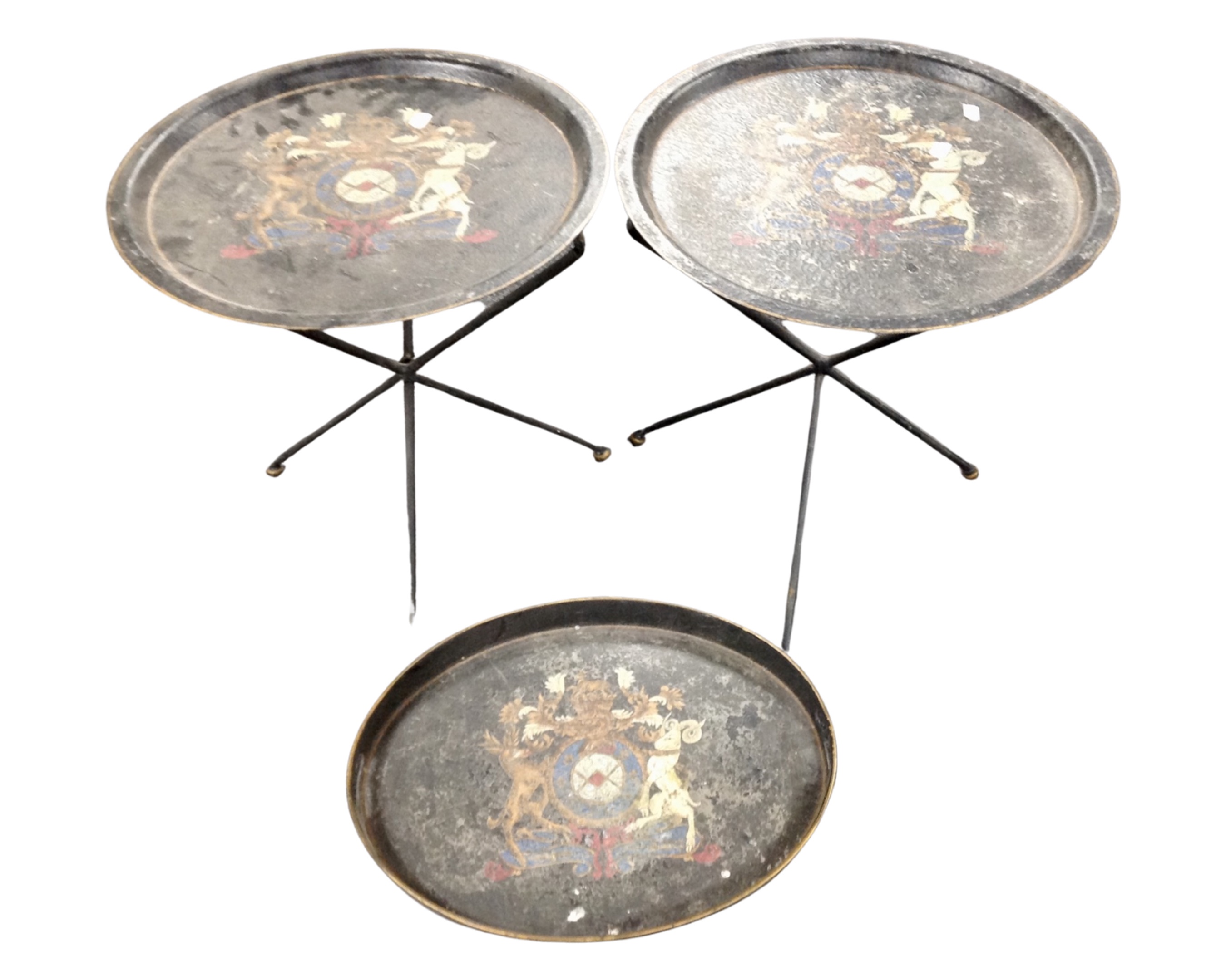 A pair of metal folding occasional tables bearing coat of arms together with matching serving tray