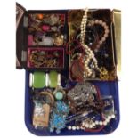 A Chinese lacquered jewellery box and a tin containing a large quantity of costume jewellery