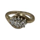 A 9ct gold diamond set cluster ring, size K. CONDITION REPORT: 3.
