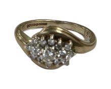 A 9ct gold diamond set cluster ring, size K. CONDITION REPORT: 3.