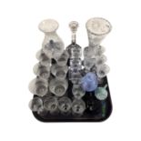 A tray containing assorted glassware including drinking glasses, glass paperweights,