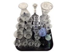 A tray containing assorted glassware including drinking glasses, glass paperweights,