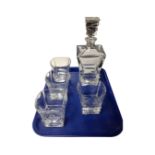 A square crystal whisky decanter together with a set of four matching glasses.