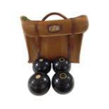 A lawn bowls bag containing a set of four Rinkmaster bowls.