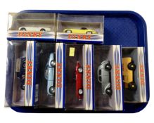 A tray containing seven boxed Dinky die cast vehicles.