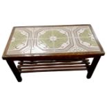 A tile topped coffee table with undershelf