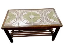 A tile topped coffee table with undershelf