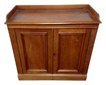 A 19th century mahogany double door cabinet with gallery