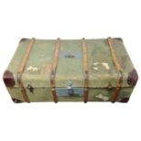 A bentwood canvas travelling trunk