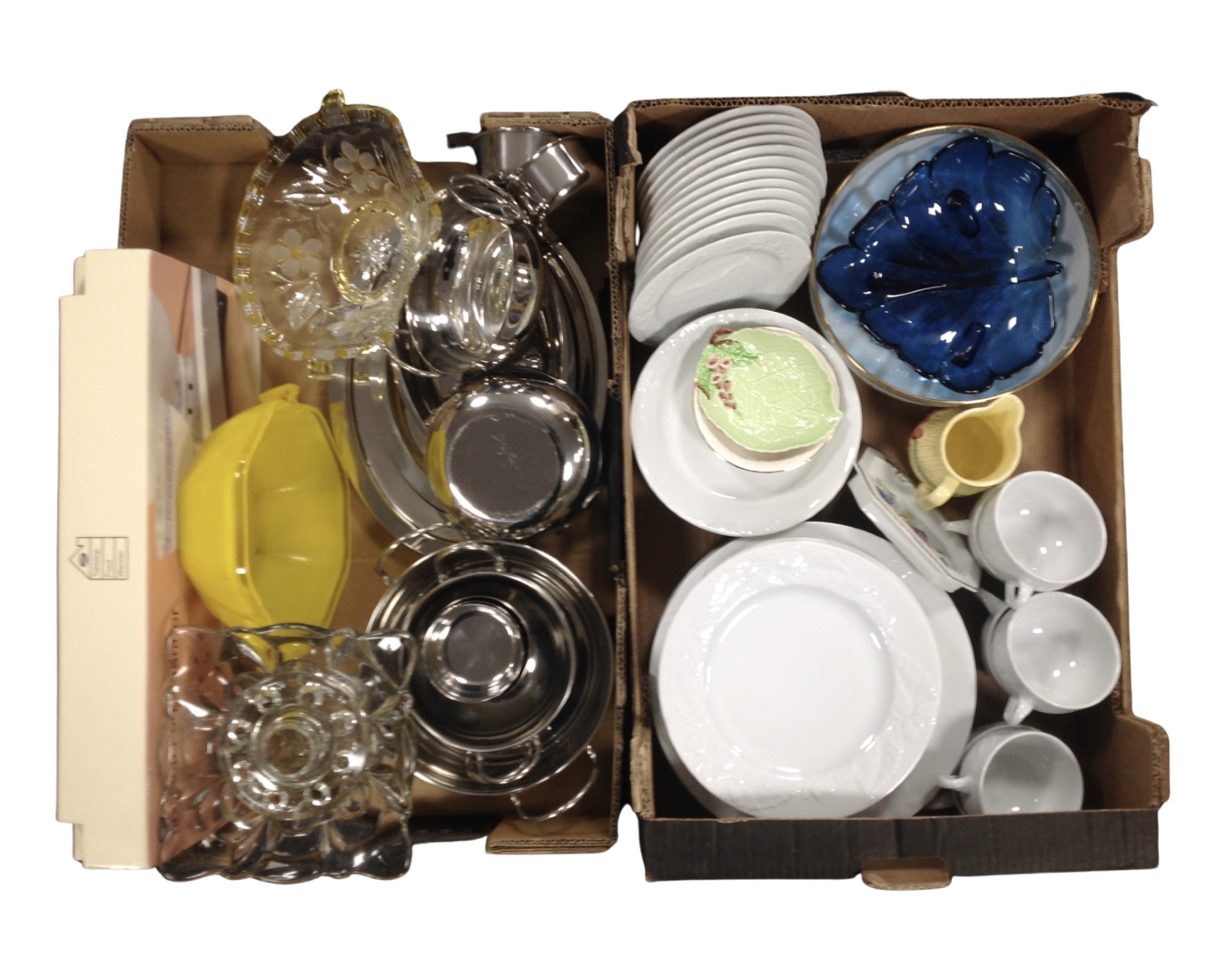 Two boxes containing stainless steel, glassware, a stained Michael Promenade tea and dinner service.