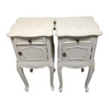 A pair of French style bedside cabinets fitted a drawer on raised legs