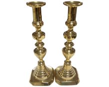 A pair of 19th century brass candlesticks (height 30.5cm).