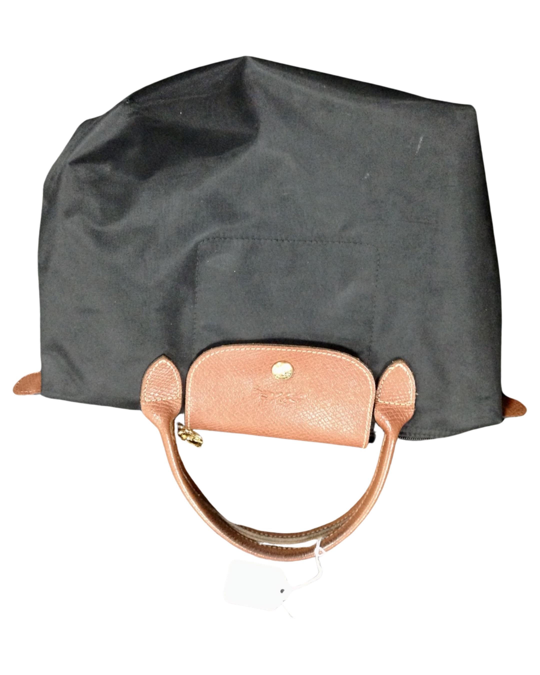 A Longchamp Le Pilage black mini tote handbag.