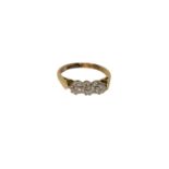 An 18ct gold three stone diamond ring, size K CONDITION REPORT: 2.