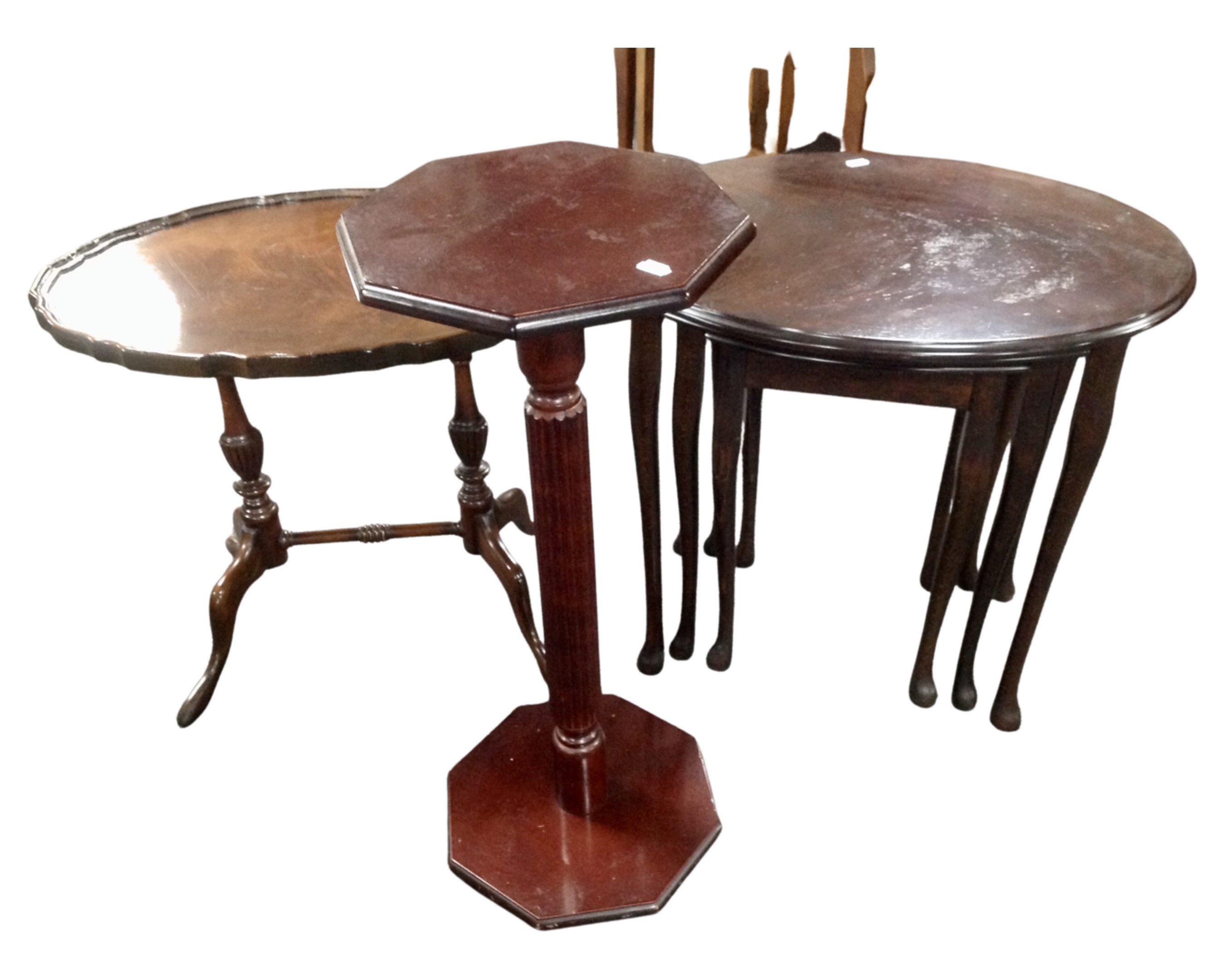 A nest of three mahogany tables together with a walnut occasional table and plant stand