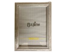 One crate containing seventeen Xenos 13 cm x 18 cm silver finish photo frames,