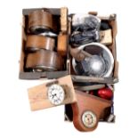Three boxes containing assorted mantel and wall clocks, a pottery bowl, a cast flat iron,