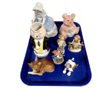 A tray containing ceramics including a Nao figure, NatWest wade pig, Hummel figures,