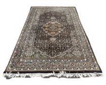 An Iranian Tabriz carpet of millefiori design, 180cm by 255cm.