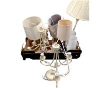 A box containing contemporary table lamps, three contemporary three-way light fittings.