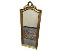 An antique gilt framed mirror, 54cm by 138cm.