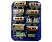 A tray containing Hornby Tri-ang tin plate 3435 engine with tender together with Pullman coaches,