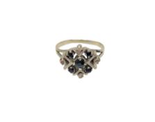 A white gold sapphire and diamond cluster ring,