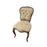 A French beechwood occasional chair on cabriole legs.
