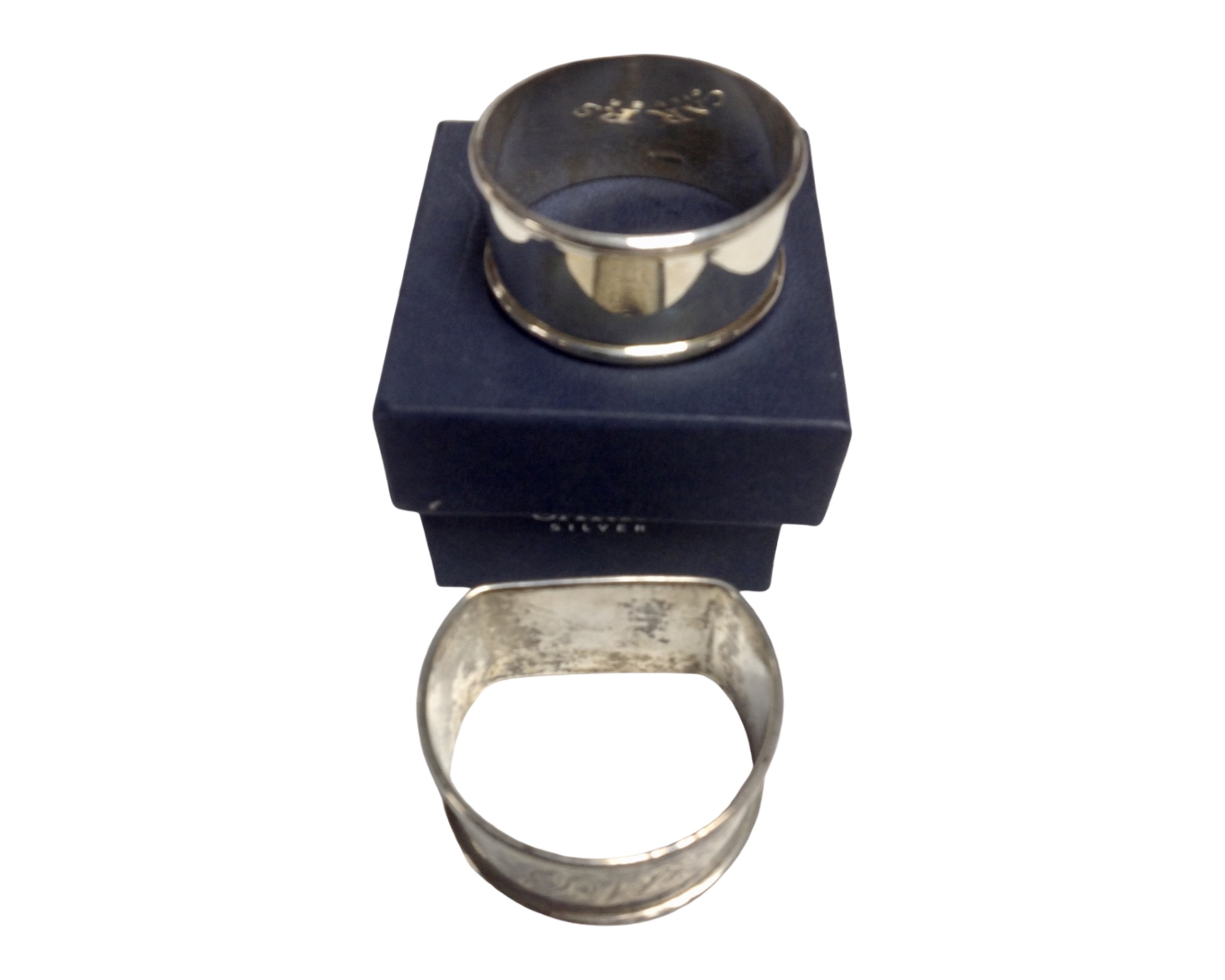 A Carr's silver napkin ring (boxed) together with a further silver napkin ring.