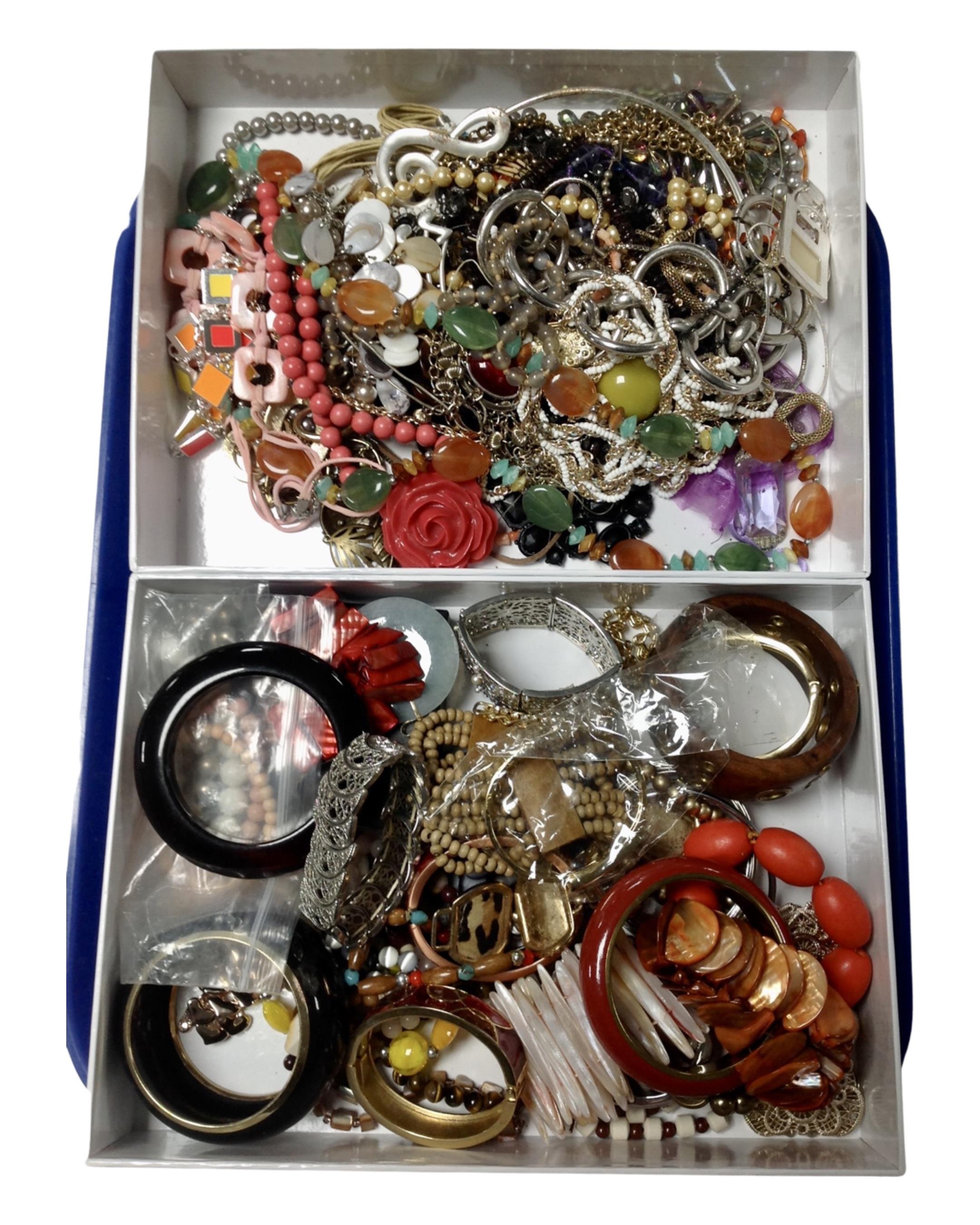 Two boxes containing a large quantity of assorted costume jewellery.