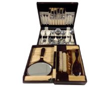 An Edwardian leather cased gent's travel set together with a further cased cutlery set.