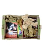 A box containing teddy bear collector's magazines and teddy bears.