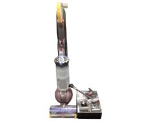 A Dyson Animal 2 upright ball vacuum together with box containing accessories.