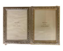 One crate containing twenty nine decorative 7" x 5" photo frames, in silver finish and gilt finish,