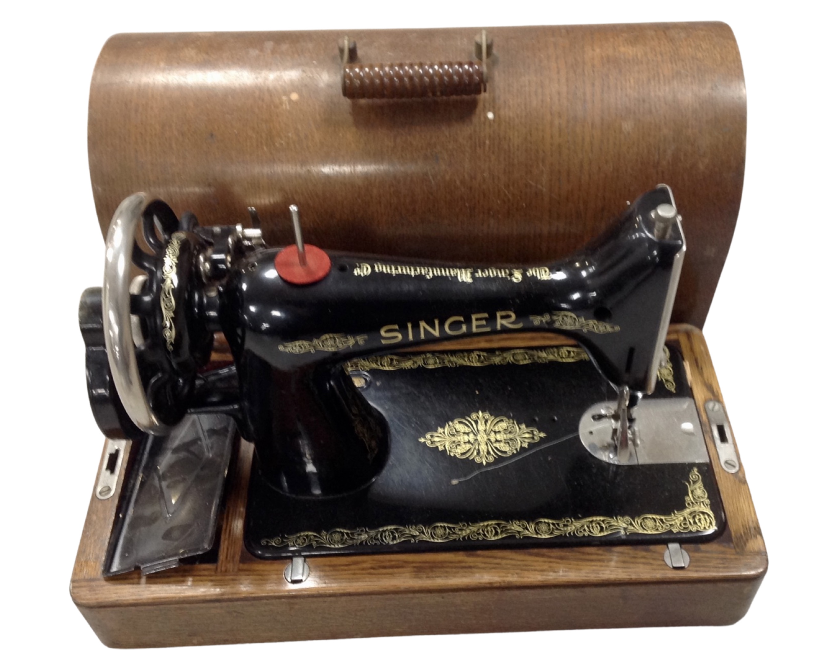 A 20th century Singer sewing machine in oak case