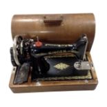 A 20th century Singer sewing machine in oak case