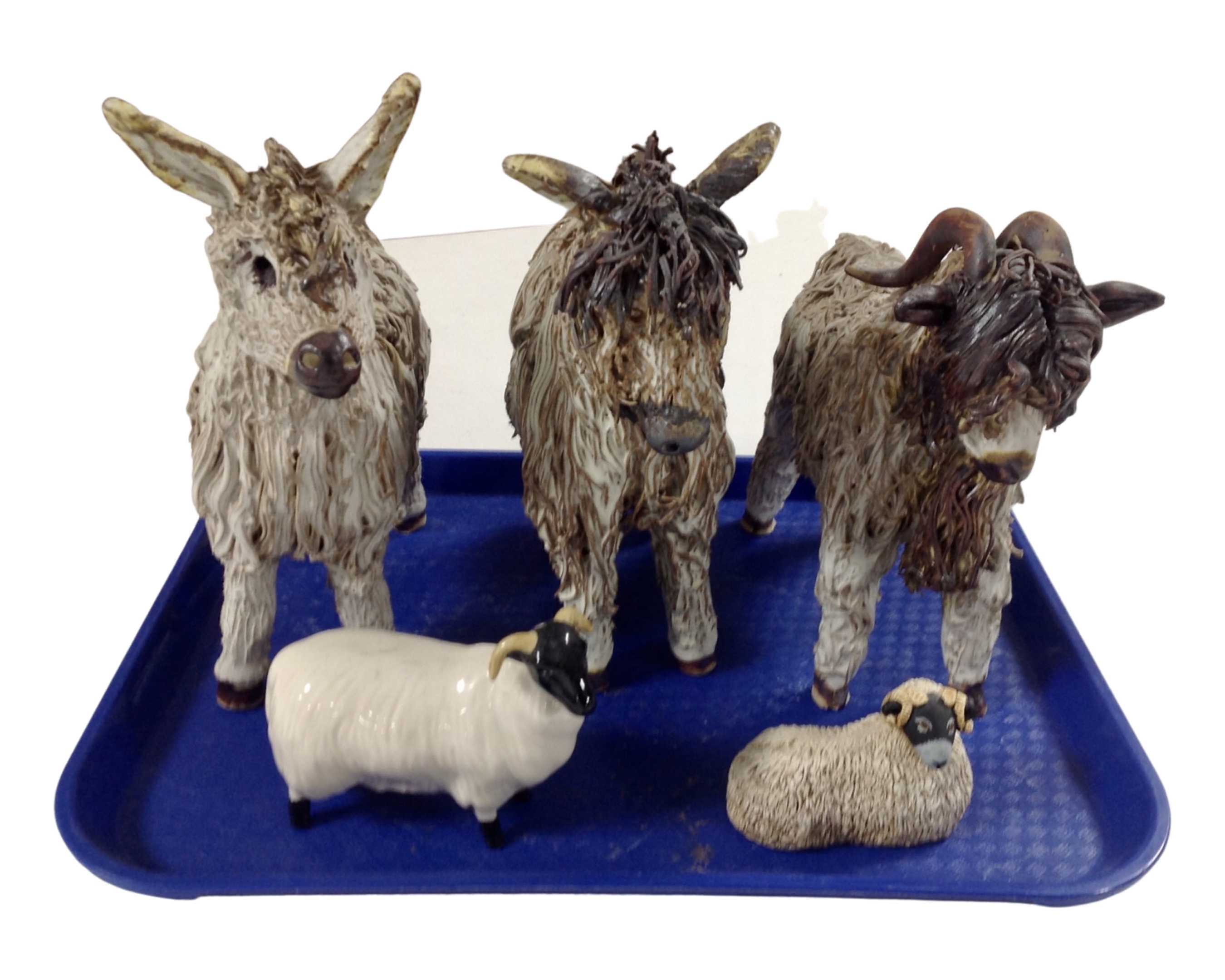 A tray containing a Beswick figure of a sheep together with three Veronica Ballan pottery figures