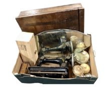 A box containing onyx lidded pots, a vintage Singer sewing machine, a frameless bevel edged mirror,