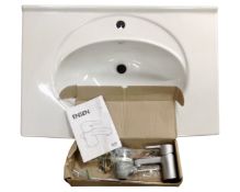A ceramic oversized sink with an Ensen mixer tap.