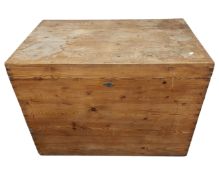 An antique pine storage box with lift up lid.