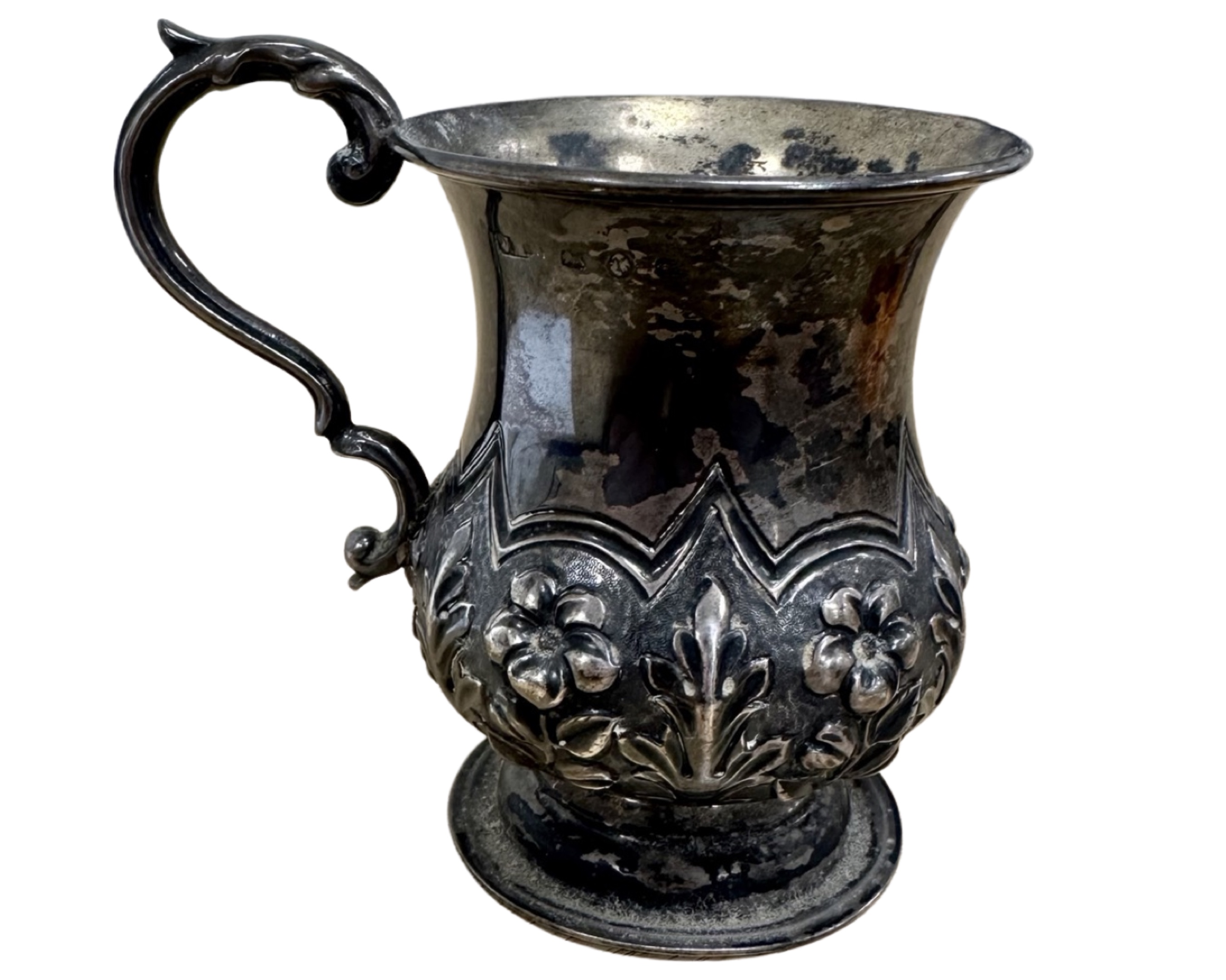 A small embossed silver mug, Birmingham marks, height 9cm.