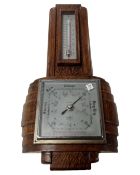 An oak cased Art Deco barometer.