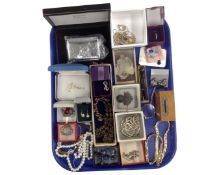 A tray containing a collection of assorted costume jewellery, a silver cross on chain,