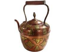 An Eastern brass and copper kettle.