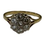 A yellow gold diamond cluster ring, shank unmarked, the total diamond weight estimated at 0.