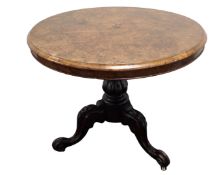 A 19th century mahogany and walnut circular pedestal occasional table.